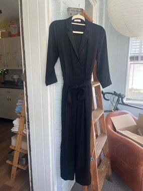 Like New Babaton Aritzia Black Wrap-Front Long Sleeve Jumpsuit with Tie Waist